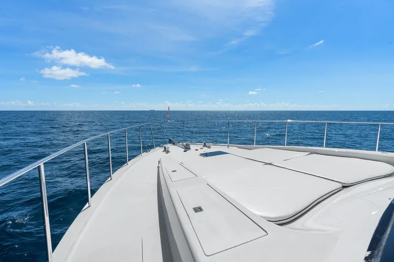 Slide: The Image of 1998 Cheoy Lee Motor Yacht cruising on open sea under clear blue sky. - 79
