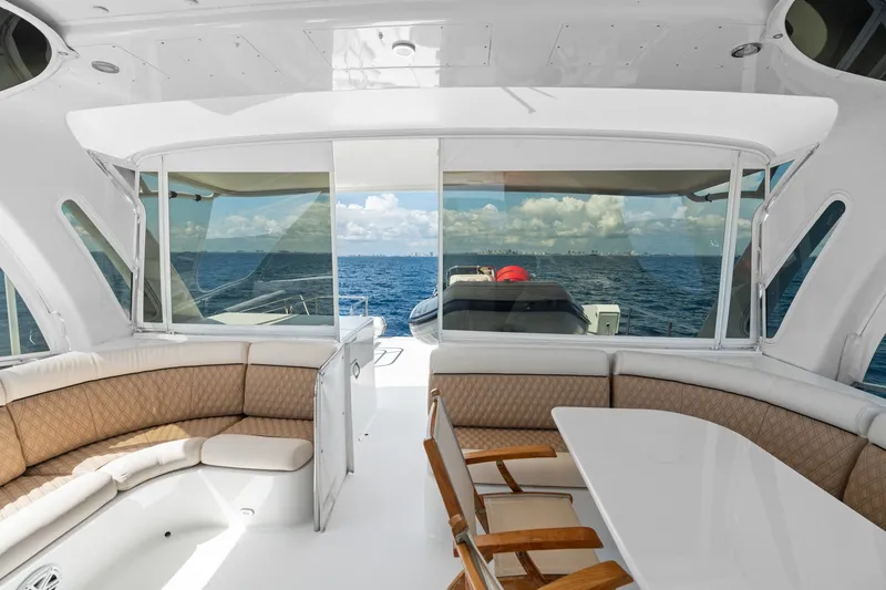 Slide: The Image of Luxurious 1998 Cheoy Lee Motor Yacht interior with ocean view and elegant seating area. - 52