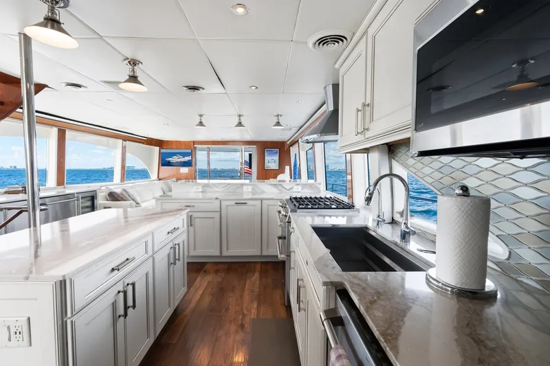 Slide: The Image of Luxurious 1998 Cheoy Lee Motor Yacht kitchen with modern appliances and ocean view. - 22