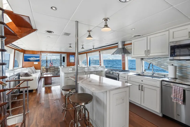 Slide: The Image of Luxurious 1998 Cheoy Lee Motor Yacht interior with modern kitchen and ocean view. - 18