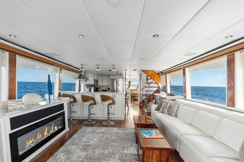 Slide: The Image of Luxurious 1998 Cheoy Lee Motor Yacht interior with modern decor, ocean views, and elegant furnishings. - 5