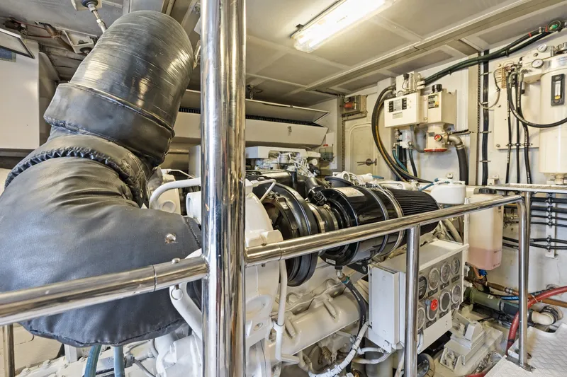 Slide: The Image of Engine room of a 1998 Cheoy Lee Motor Yacht, showcasing machinery and equipment. - 87
