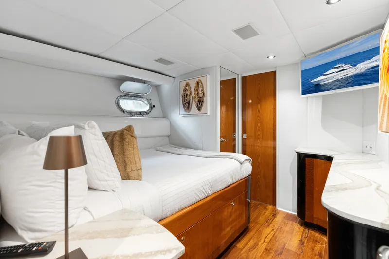 Slide: The Image of Luxurious 1998 Cheoy Lee Motor Yacht bedroom with elegant wood finishes and modern decor. - 34