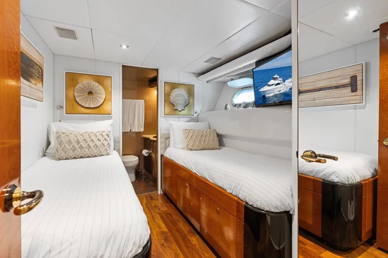 Slide: The Image of Luxurious 1998 Cheoy Lee Motor Yacht cabin with twin beds and elegant decor. - 38