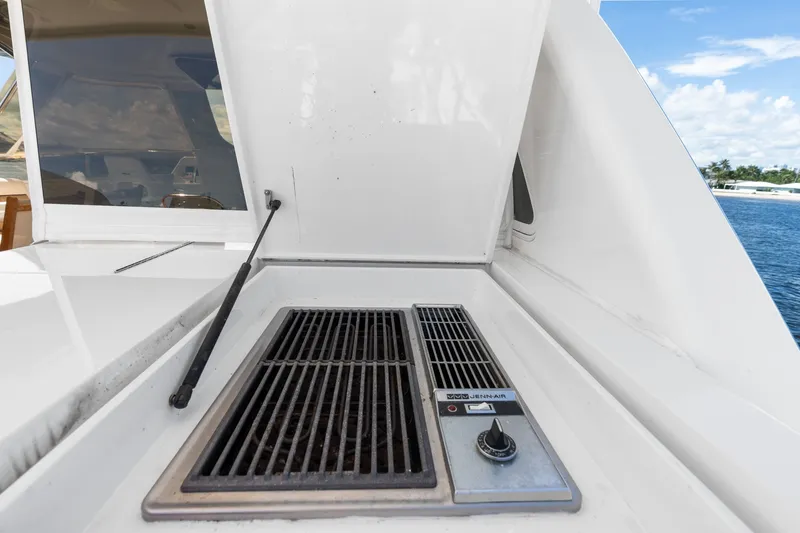 Slide: The Image of Outdoor grill on 1998 Cheoy Lee Motor Yacht deck, overlooking water and sky. - 60