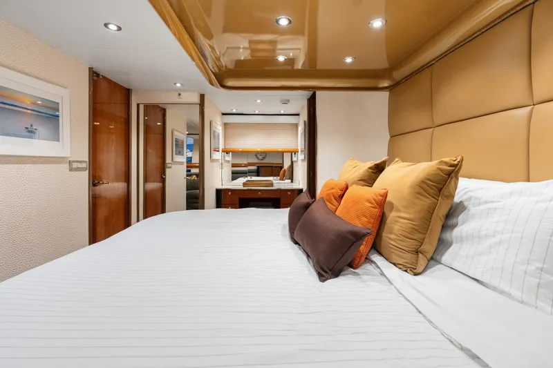 Slide: The Image of Luxurious 1998 Cheoy Lee Motor Yacht bedroom with elegant decor and plush bedding. - 29