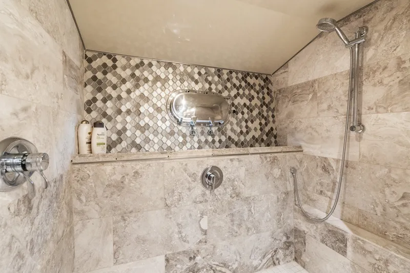 Slide: The Image of Luxurious marble shower in 1998 Cheoy Lee Motor Yacht, featuring elegant tile design and modern fixtures. - 33