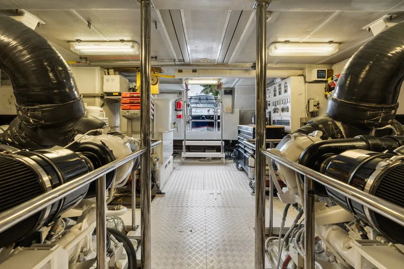 Slide: The Image of Engine room of a 1998 Cheoy Lee Motor Yacht, showcasing machinery and equipment. - 83