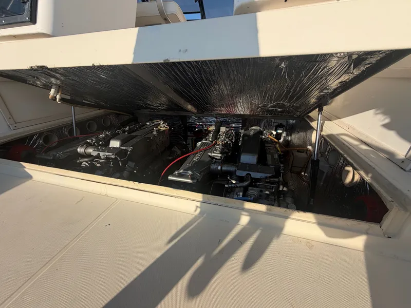 Slide: The Image of The engine compartment of a 1999 Carolina Classic 28 with two engines is visible. - 15