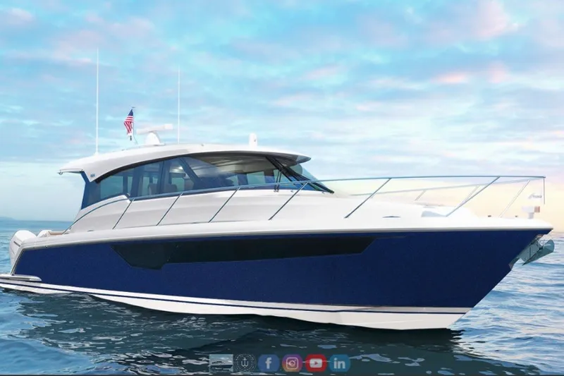 The Image of 2027 Tiara Yachts 48 LE luxury yacht cruising on calm waters under a vibrant sky. - 0