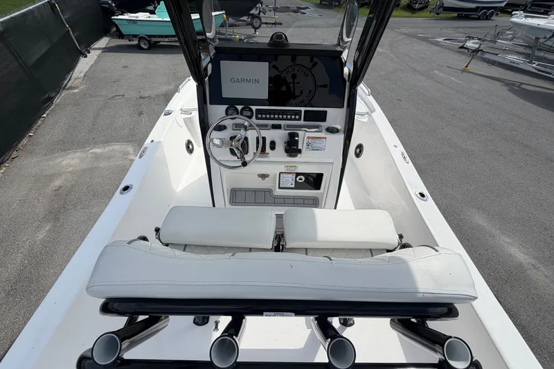 Slide: The Image of 2025 Sea Fox 251 Bay Fox boat interior with Garmin navigation system and sleek white seating. - 16