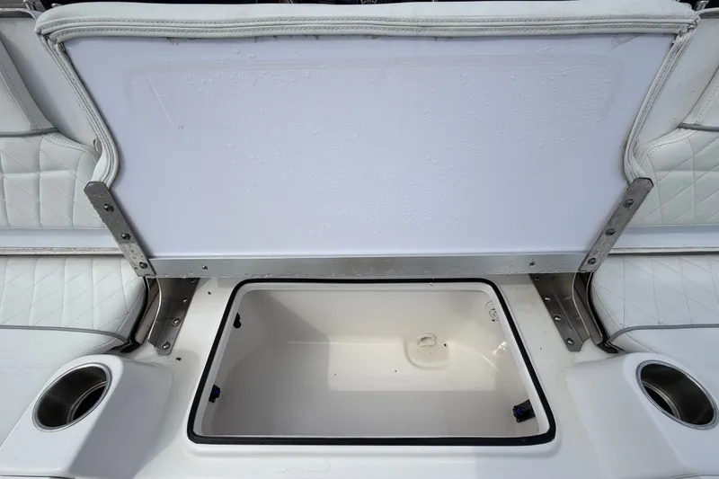 Slide: The Image of Open storage compartment on 2025 Sea Fox 251 Bay Fox boat with cup holders. - 72
