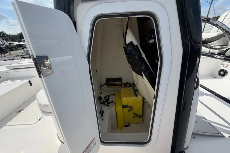 Slide: The Image of Open storage compartment on a 2025 Sea Fox 251 Bay Fox boat, showing safety equipment. - 35