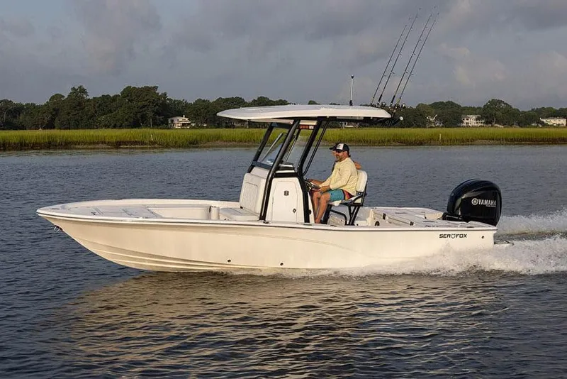 The Image of Manufacturer Provided Image: 2025 Sea Fox 251 Bay Fox boat cruising on a calm river. - 1