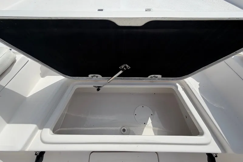 Slide: The Image of An open storage compartment on a 2025 Sea Fox 251 Bay Fox boat. - 42