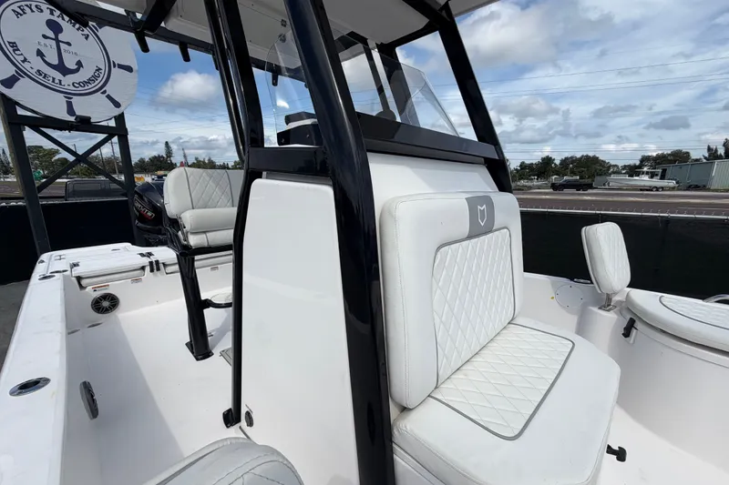Slide: The Image of 2025 Sea Fox 251 Bay Fox boat interior with white seating and modern design. - 60