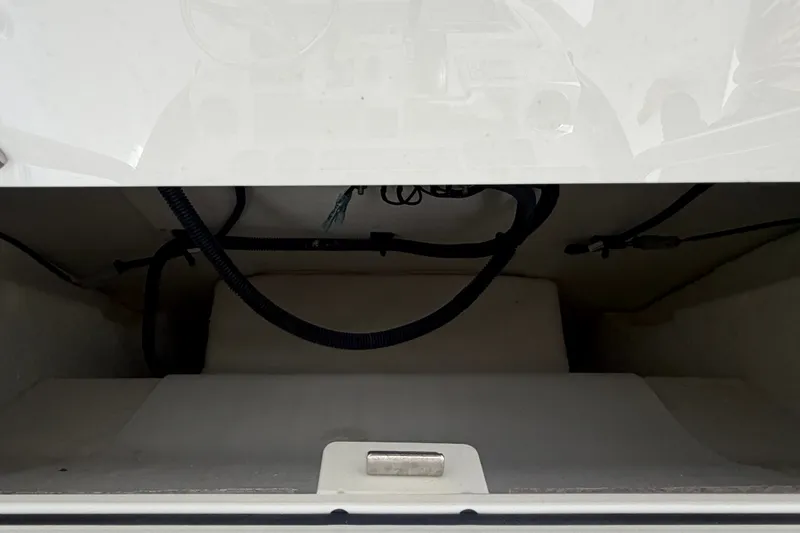 Slide: The Image of Storage compartment of 2025 Sea Fox 251 Bay Fox boat, featuring wiring and interior space. - 21