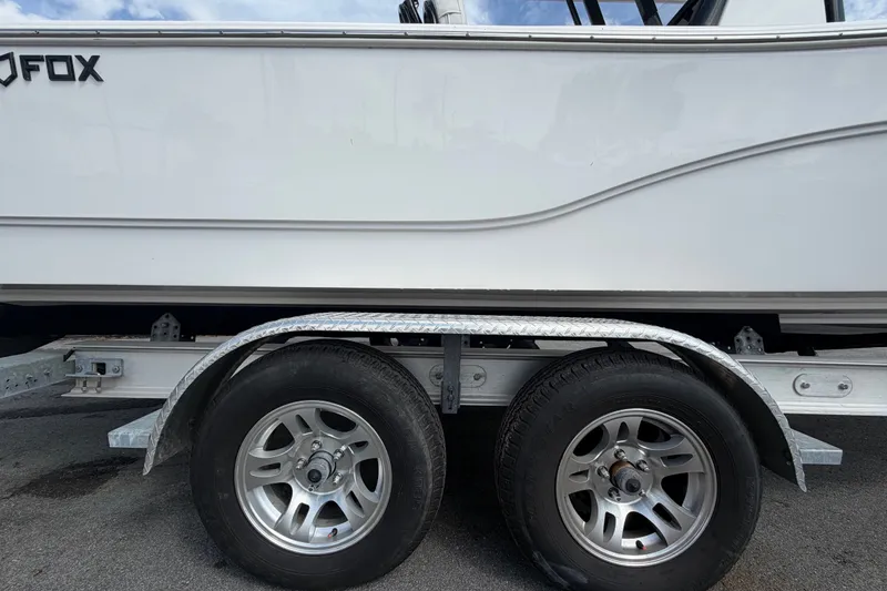 Slide: The Image of 2025 Sea Fox 251 Bay Fox boat on trailer with dual wheels. - 88
