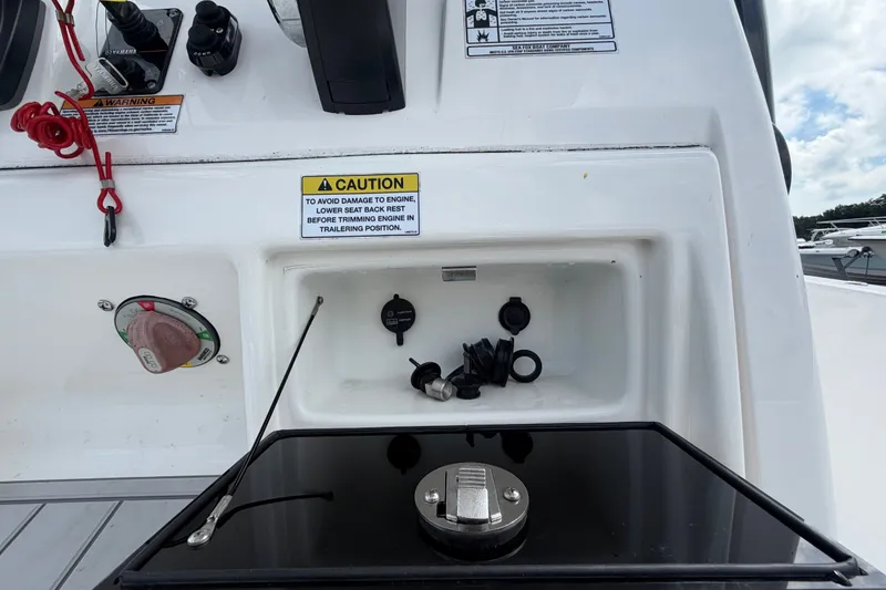 Slide: The Image of Control panel of 2025 Sea Fox 251 Bay Fox boat with caution label and switches. - 32