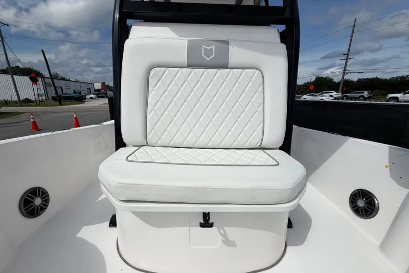 Slide: The Image of 2025 Sea Fox 251 Bay Fox boat seat with diamond-stitched white upholstery. - 56