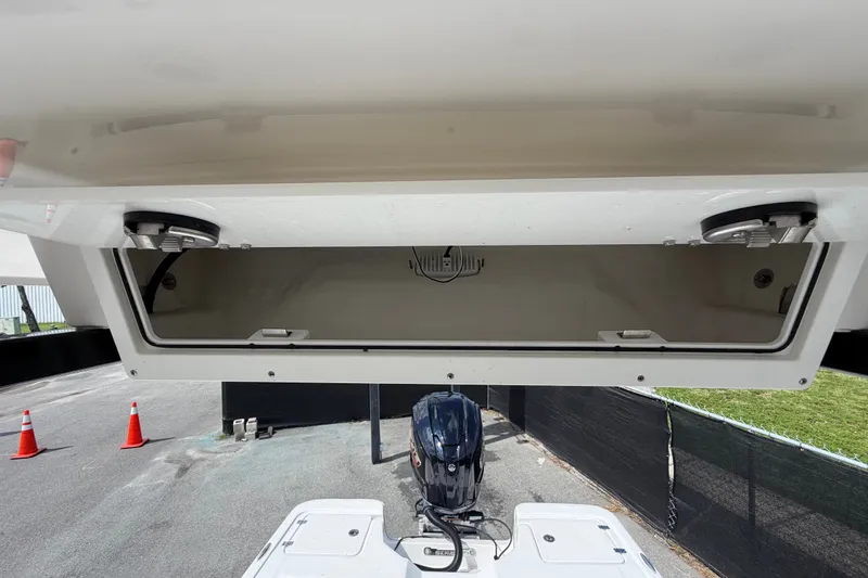 Slide: The Image of 2025 Sea Fox 251 Bay Fox boat storage compartment with open lid, showcasing spacious interior. - 62