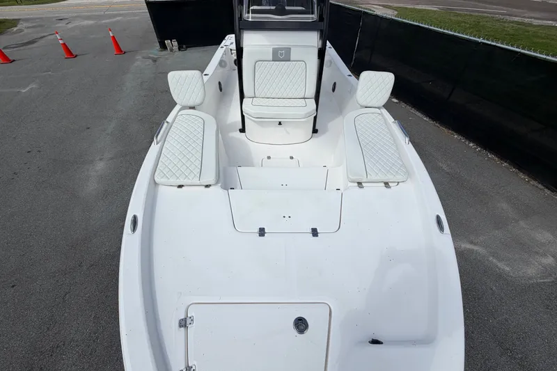 Slide: The Image of 2025 Sea Fox 251 Bay Fox boat with white seating and spacious deck. - 46