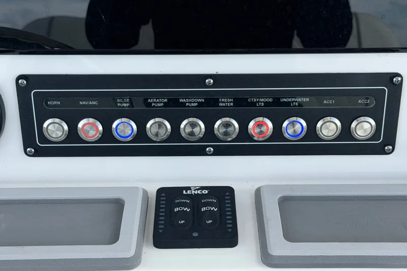 Slide: The Image of Control panel of 2025 Sea Fox 251 Bay Fox boat with labeled switches and buttons. - 27