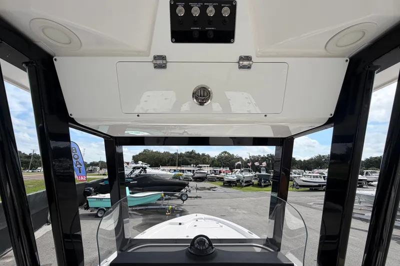 Slide: The Image of 2025 Sea Fox 251 Bay Fox boat interior view at a dealership. - 19