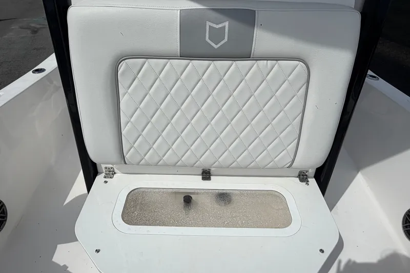 Slide: The Image of 2025 Sea Fox 251 Bay Fox boat seat with diamond-stitched upholstery and storage compartment. - 58
