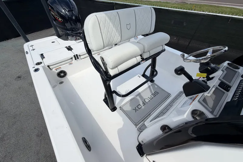 Slide: The Image of 2025 Sea Fox 251 Bay Fox boat interior with white seating and steering console. - 64