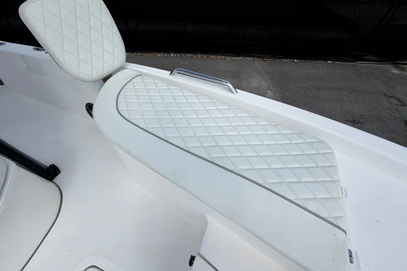 Slide: The Image of 2025 Sea Fox 251 Bay Fox boat seat with diamond-stitched white upholstery. - 49