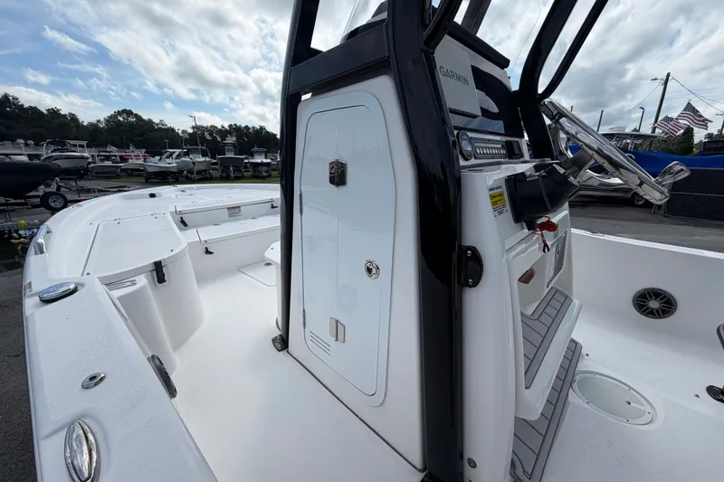Slide: The Image of 2025 Sea Fox 251 Bay Fox boat interior with steering console and seating area. - 33