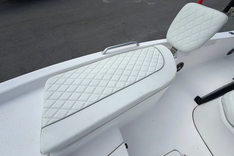 Slide: The Image of 2025 Sea Fox 251 Bay Fox boat with white quilted seating detail. - 51