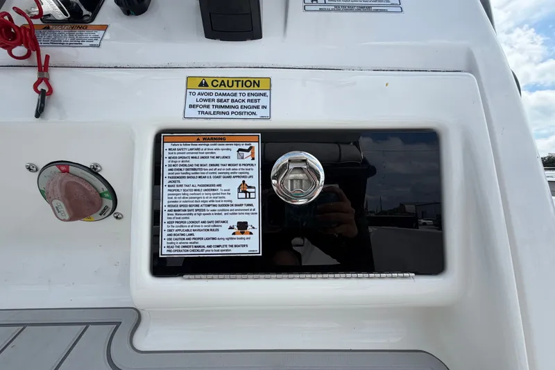 Slide: The Image of 2025 Sea Fox 251 Bay Fox dashboard with caution and warning labels. - 31