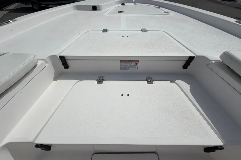 Slide: The Image of 2025 Sea Fox 251 Bay Fox boat deck with storage compartments and seating. - 41