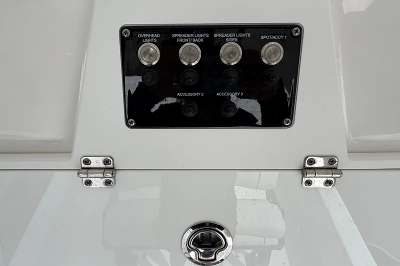 Slide: The Image of Control panel on 2025 Sea Fox 251 Bay Fox boat with light switches and accessories. - 20