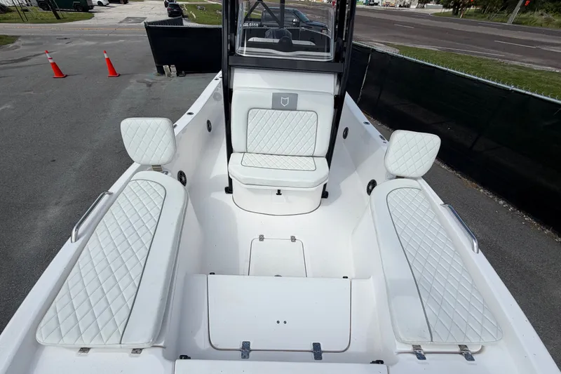Slide: The Image of 2025 Sea Fox 251 Bay Fox boat interior with white quilted seating and spacious layout. - 48