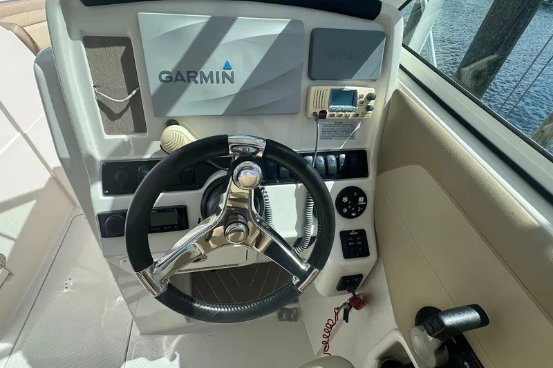 Slide: The Image of Steering console of 2020 Sailfish 245 DC boat with Garmin navigation system. - 18