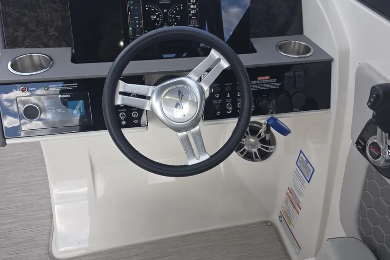 Slide: The Image of Steering console of 2020 Sea Ray SDX 290 boat with modern controls and display. - 11