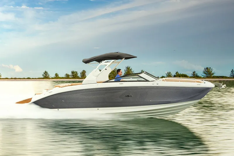Slide: The Image of Manufacturer Provided Image: 2020 Sea Ray SDX 290 speedboat cruising on a calm lake. - 1