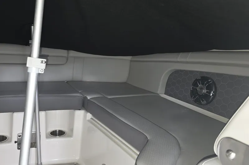 Slide: The Image of Interior seating of 2020 Sea Ray SDX 290 boat with speaker and metal pole. - 16
