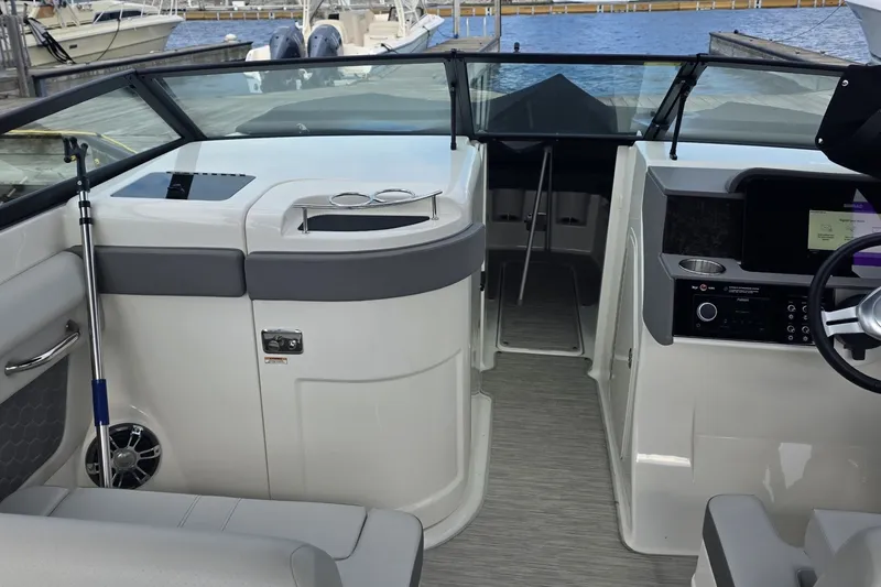 Slide: The Image of 2020 Sea Ray SDX 290 boat interior with helm and seating area. - 7