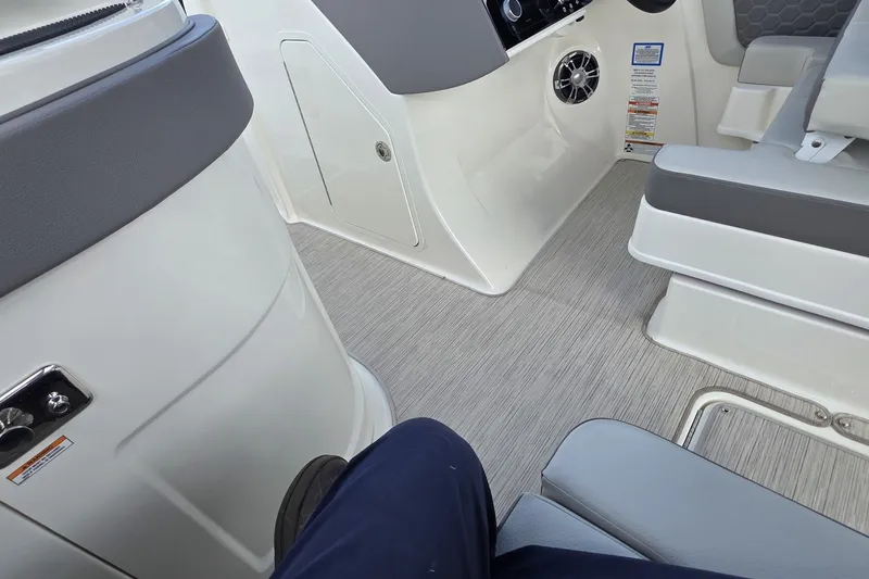 Slide: The Image of Interior view of a 2020 Sea Ray SDX 290 boat cockpit area. - 25