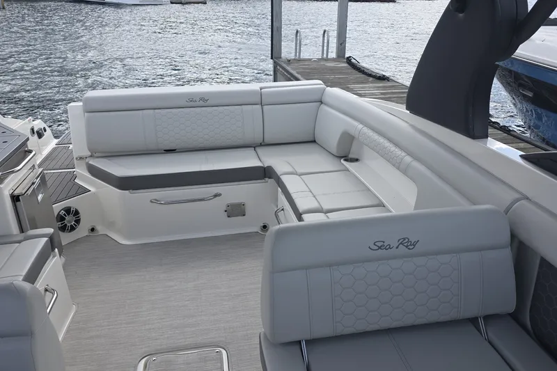 Slide: The Image of 2020 Sea Ray SDX 290 boat interior with luxurious seating by the water. - 29