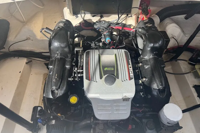Slide: The Image of Engine compartment of a 2014 Sea Ray SLX 250 boat, featuring a MerCruiser engine. - 16