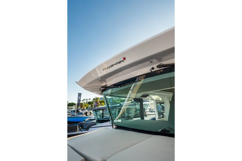 Slide: The Image of 2027 Axopar 38 XC Cross Cabin boat, showcasing sleek design and modern features. - 10