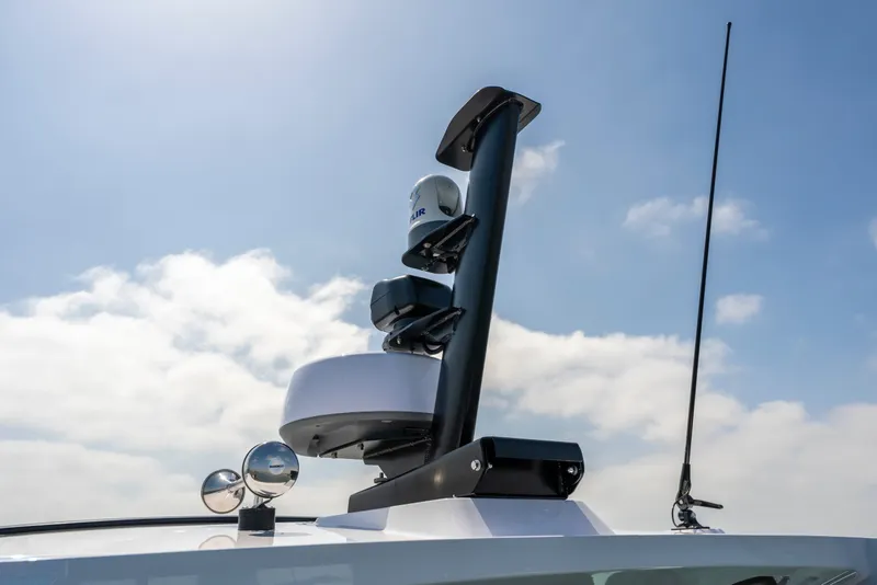 Slide: The Image of Rooftop equipment on 2027 Axopar 38 XC Cross Cabin against a clear sky. - 11