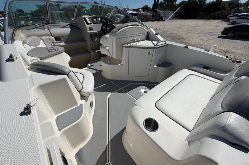 Slide: The Image of 2007 Sea Ray 240 Sundancer boat interior with seating and helm controls. - 17