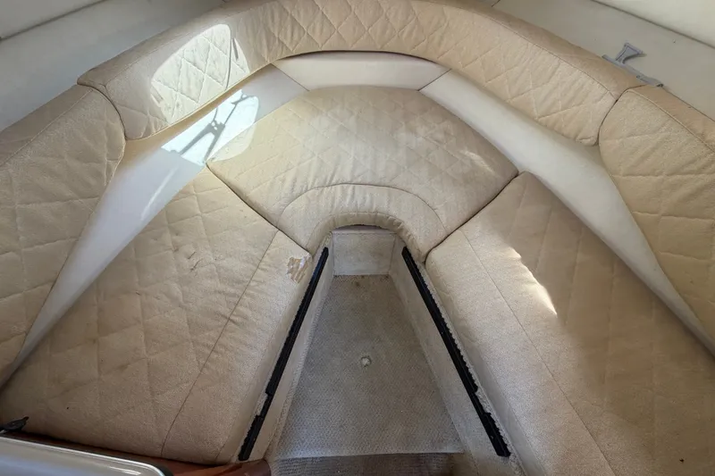 Slide: The Image of Interior cabin of a 2007 Sea Ray 240 Sundancer with beige upholstery. - 57