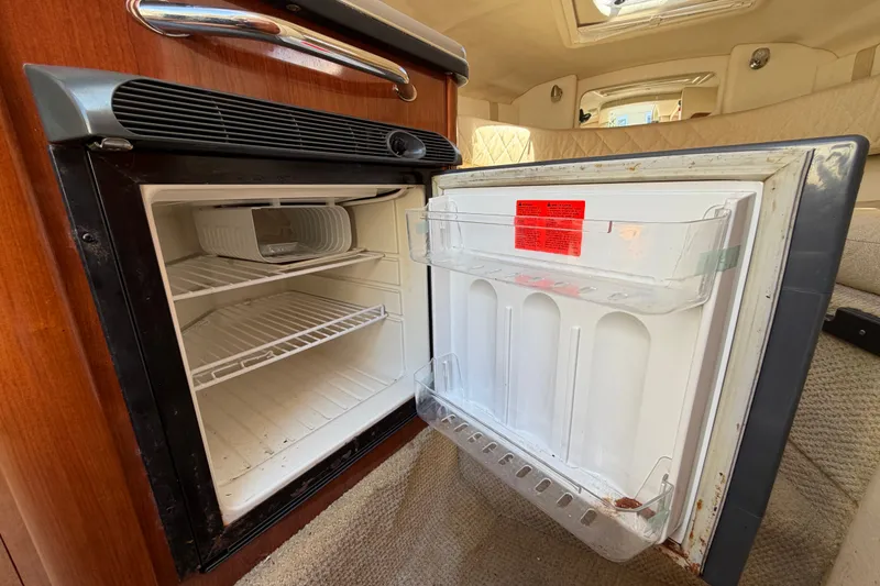 Slide: The Image of Open refrigerator inside 2007 Sea Ray 240 Sundancer boat cabin. - 55